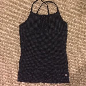 Tank with cross over straps