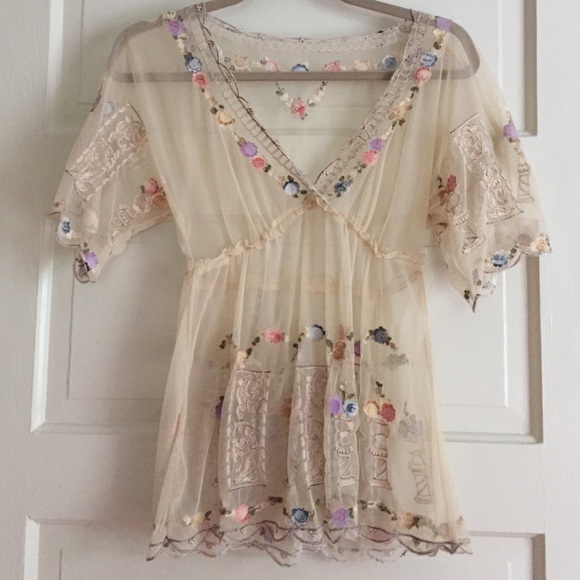 Anthropologie embroidered blouse.