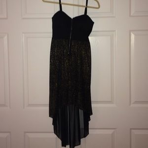 Black and Gold high/low dress. Zipper in front.