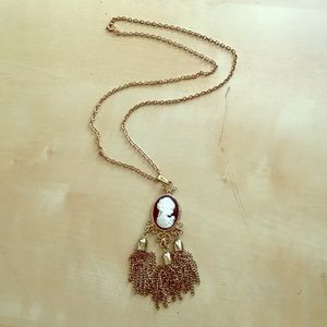 Gold silhouette tassel necklace