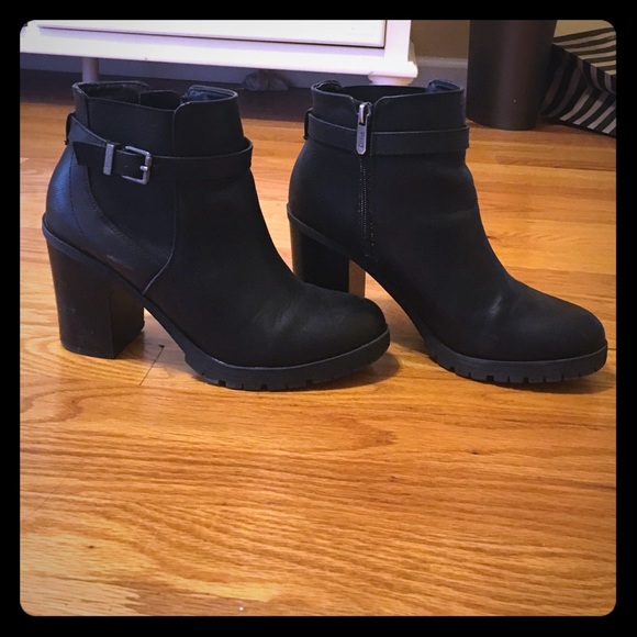 Worn black leather ankle boots