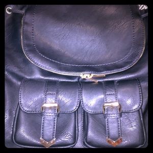 Leather like backpack.