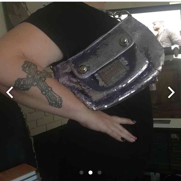 Coach purple purse is sold pink is avil