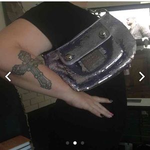 Coach purple purse is sold pink is avil