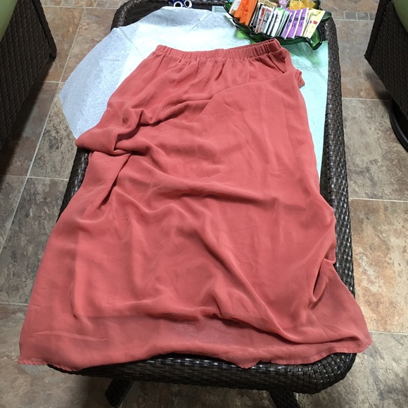 Sheer salmon maxi skirt over opaque material