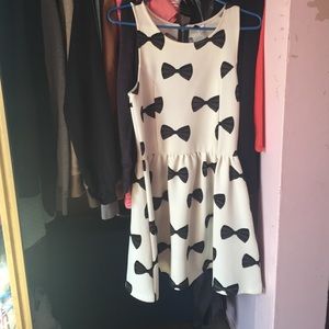 White mini dress with black bows