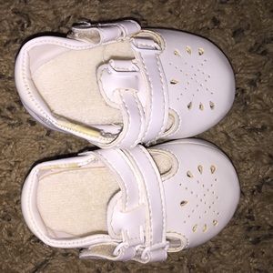 Adorable all white baby shoes.