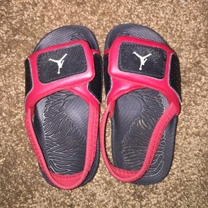 Size 9 black and red Jordan sandals.