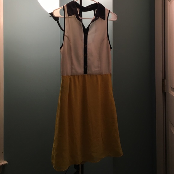 Black white and yellow button collar dress