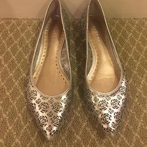 Silver BCBG flats with cutout designs