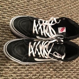 Black leather high top vans