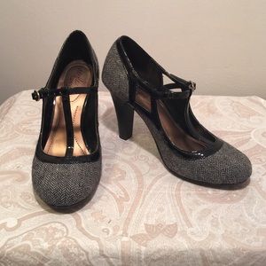 Gray, black, and white heels