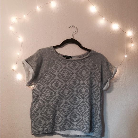 Grey short sleeved tribal pattern sweatshirt.