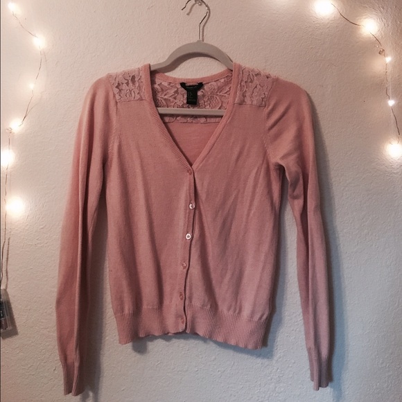 Light pink button up sweater with lace detail.
