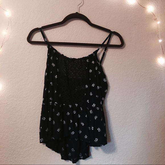 Blue floral camisole with lace front and peplum .