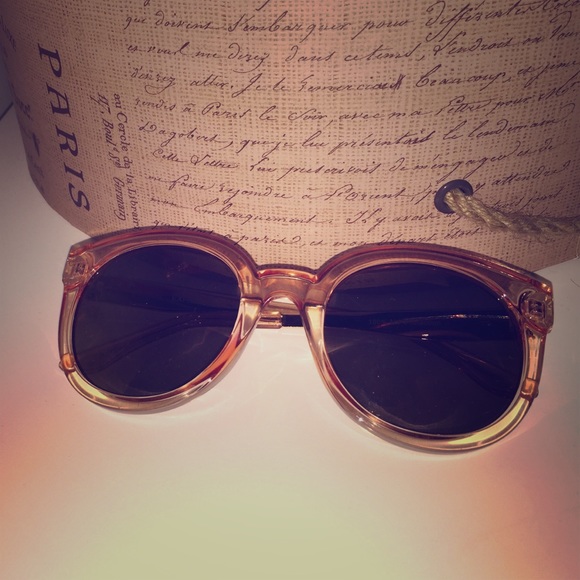 Express Clear peachy sunglasses with dark glasses