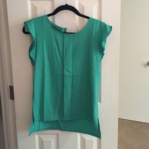 Green sleeveless blouse
