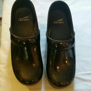Dansko black patent leather clogs