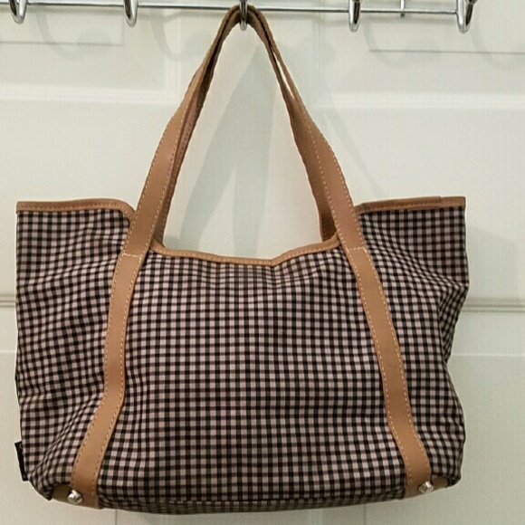 A mid size Ocala handbag in brown and black.