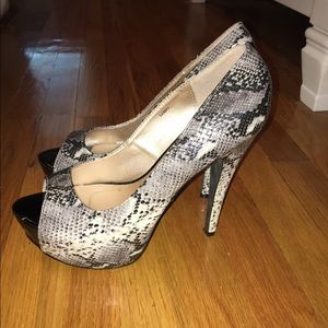 Size 10, black, white, and grey healed shoes.