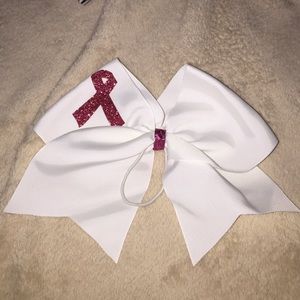 white bow with beast cancer sign in pink