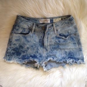A pair of acid wash high-rise shorts from PacSun