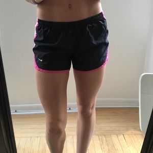 Pink and black Nike running shorts