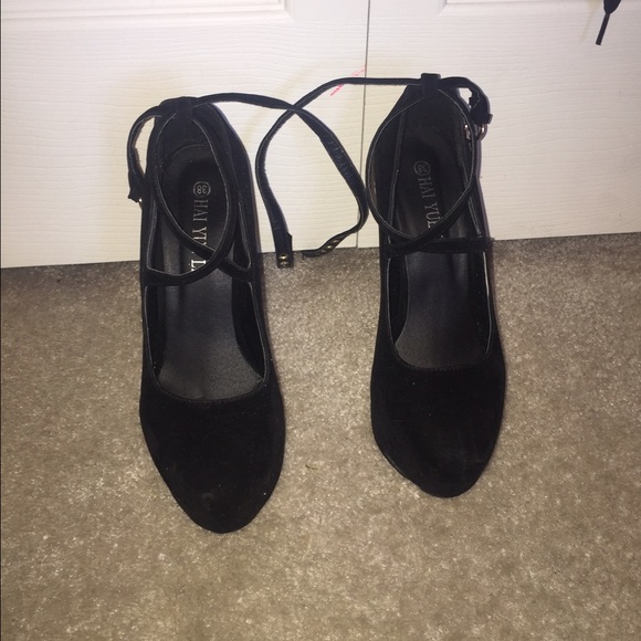 Strappy red bottom heels