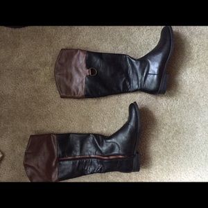 Tan and black riding boots