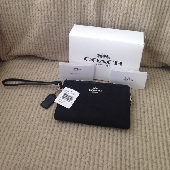 Black coach wristlet**Firm on price**