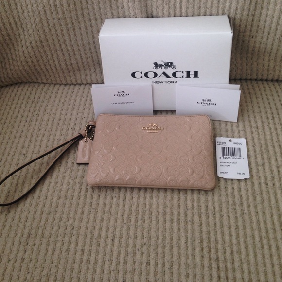 Coach Wristlet-**Firm on price**