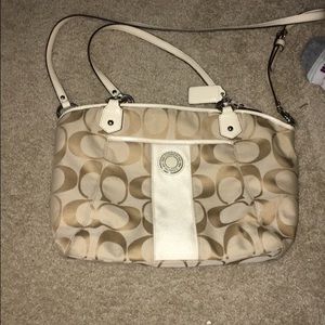Cream colored coach purse