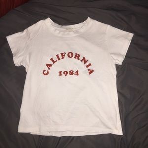 Brandy Melville California 1984 DAMAGED crop tee