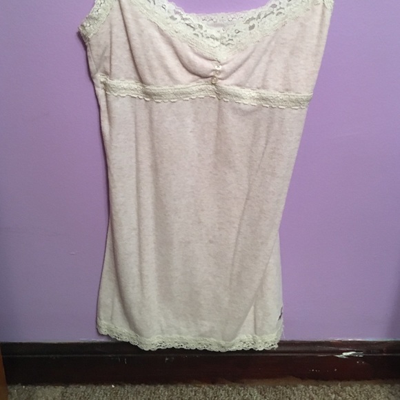 A very  light pink and lace tank top