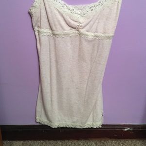 A very  light pink and lace tank top