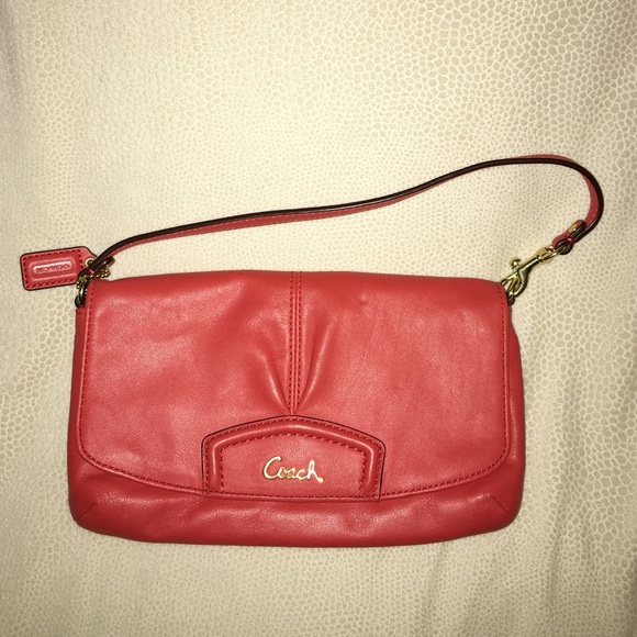 Peach colored Coach wristlet