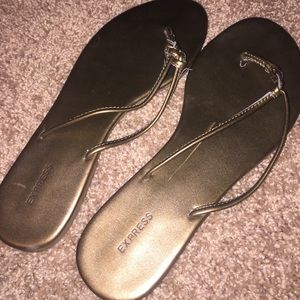 Size 10 express gold flip flops