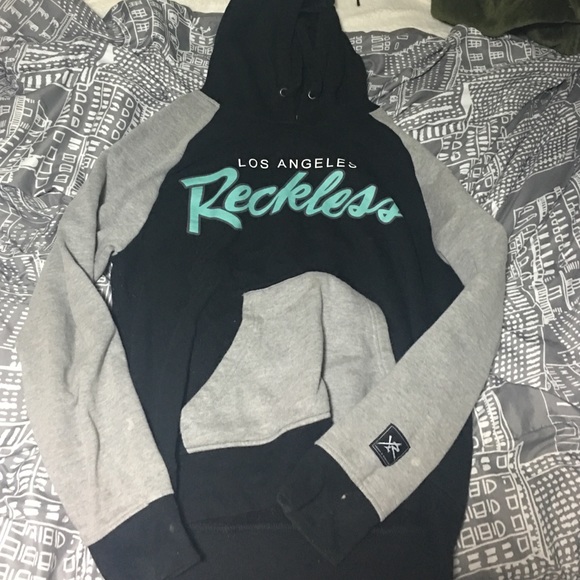 Young and reckless sweater