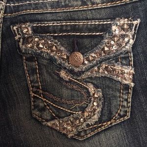 Embellished flap pockets on Silver jeans