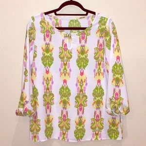 Pastel patterned top. Never worn out and about