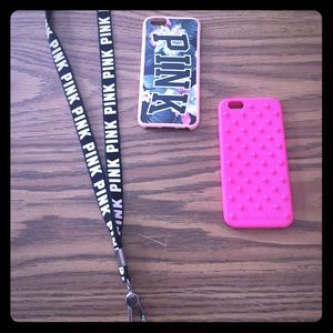 Two VS PINK phone cases and a PINK lanyard