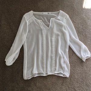 Sheer, white 3/4 sleeved New York and Company top.