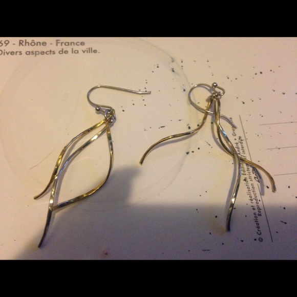Silver and gold colored metal earrings