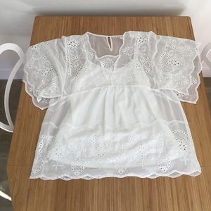 White flowy blouse from Anthropologie