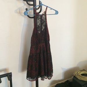 Sleeveless red and black lace dress
