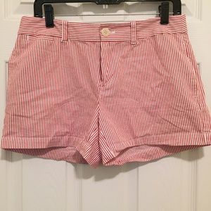 Red and white striped Vineyard Vines shorts.