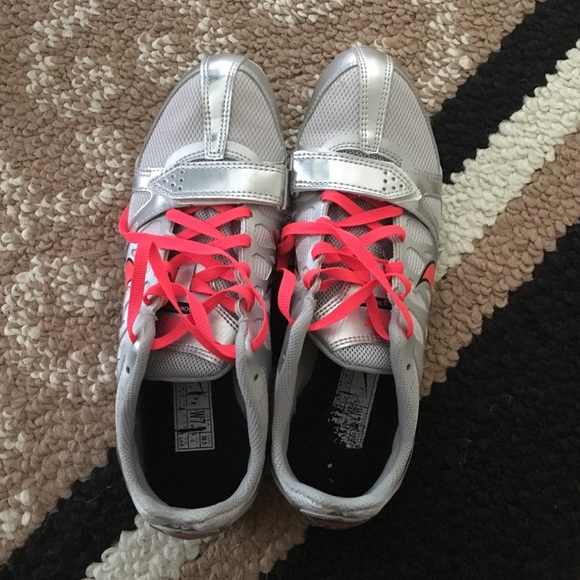 Brand new Nike track cleats with spikes. 7 wide.