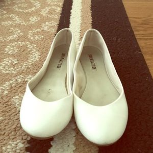 Eggshell white faux leather flats