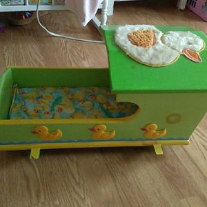 Toy baby doll cradle