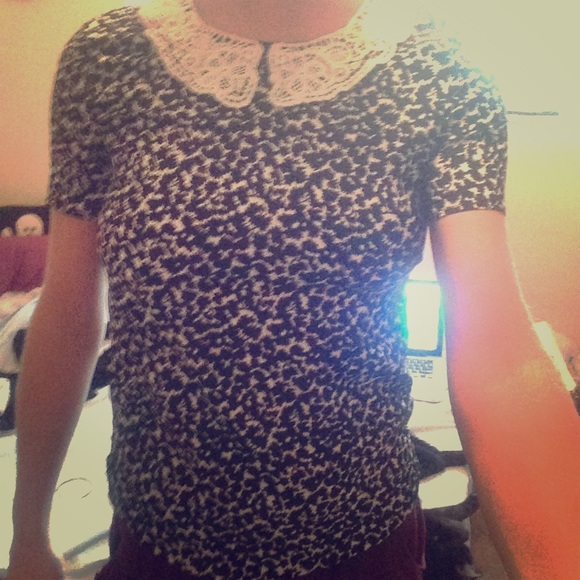Black patterned top with white lace collar